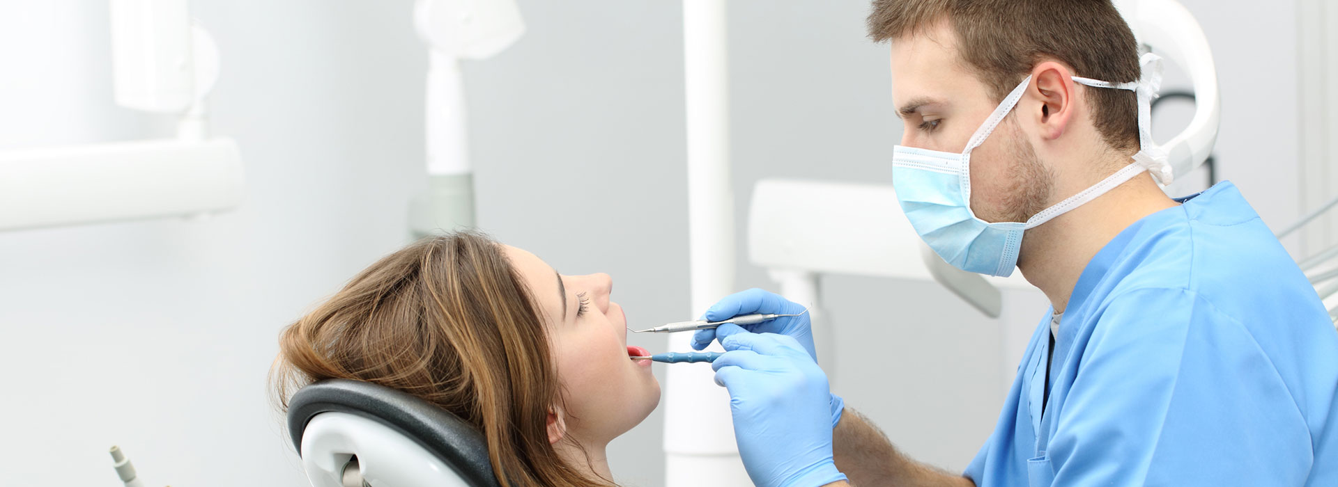 A dentist performing a dental surgery.